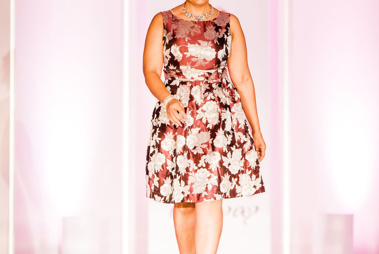 Dora Alviter smiles from ear to ear as she enters the runway. Photographed by Jennifer Costa Photography