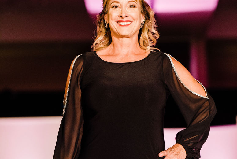 Kim Petersen smiles as she wraps up her walk down the runway. Photographed by Jennifer Costa Photography
