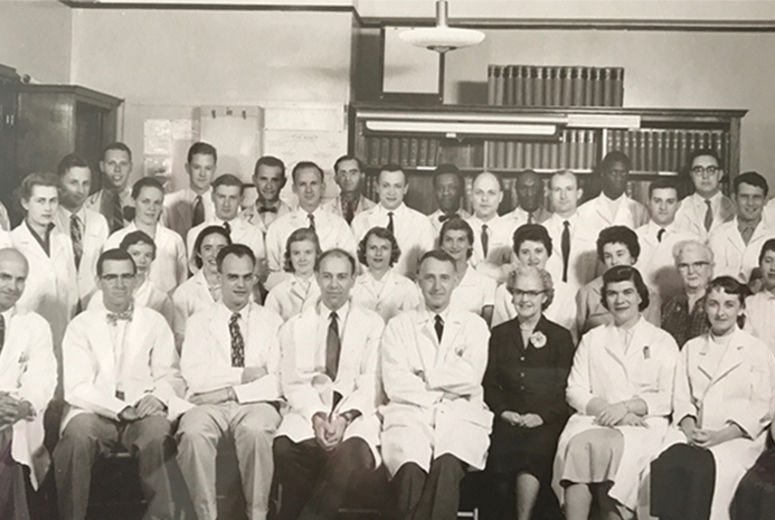 Louis Smith, MD, class of 1949, who performed the first kidney transplant at Loma Linda, is pictured (front row, second from left) sitting next to Joseph Murray, MD, who performed the world’s first successful human organ transplant — a kidney. This group photo was taken in 1958 in the laboratory of Francis Moore, MD, who was part of the team performing that first transplant. 