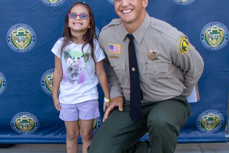 LLU Children's Hospital patients paired with San Bernardino County Sheriff’s Department members to shop for school supplies, healthcare products and clothes.