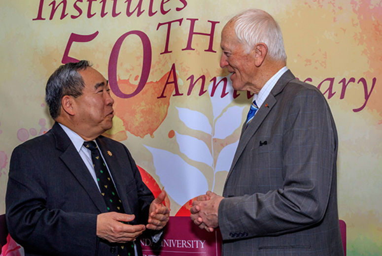 Infant heart transplant pioneer Leonard Bailey, MD, speaks with former acting Surgeon General Kenneth Moritsugu, MD, MPH, at the 50th anniversary celebration of organ transplantation at Loma Linda University Health. Moritsugu advocates for organ donation as both a public health issue and a personal mission. In separate vehicular accidents in the 1990s, both his wife and one of his daughters died. Knowing their donated organs helped others live brought solace to Moritsugu.