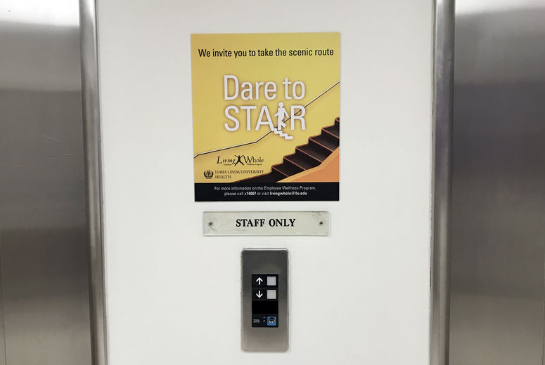 Signs that encourage walking have been placed in public areas of Loma Linda University Medical Center in a program developed by the organization’s Living Whole Program.
